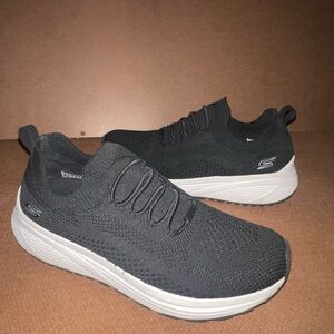 Skechers black and white Slip Ons 9.5